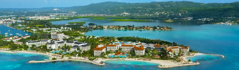 Aerial view of Montego Bay coastline and hillside homes