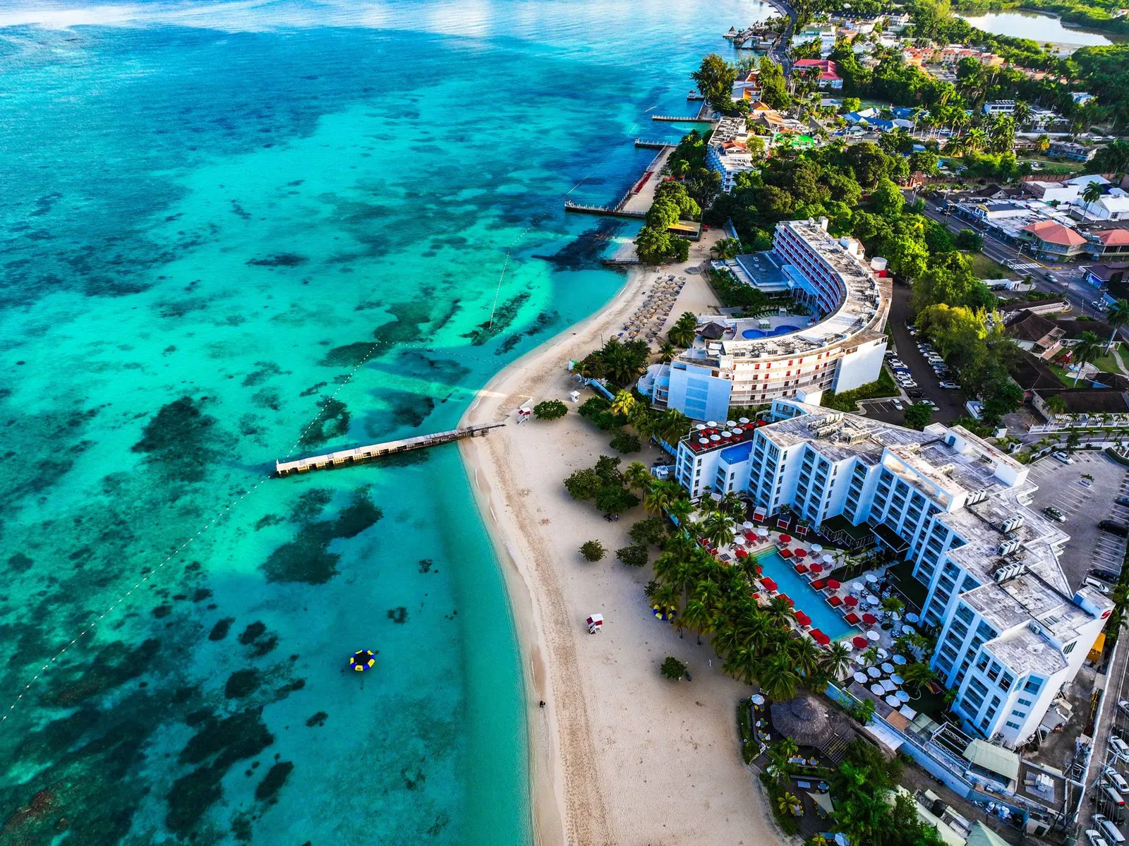 Aerial view of Montego Bay's turquoise coastline and waterfront hotels