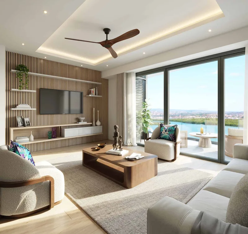 Computer-generated image of a residence lounge at The Pinnacle with a balcony view over the lagoon