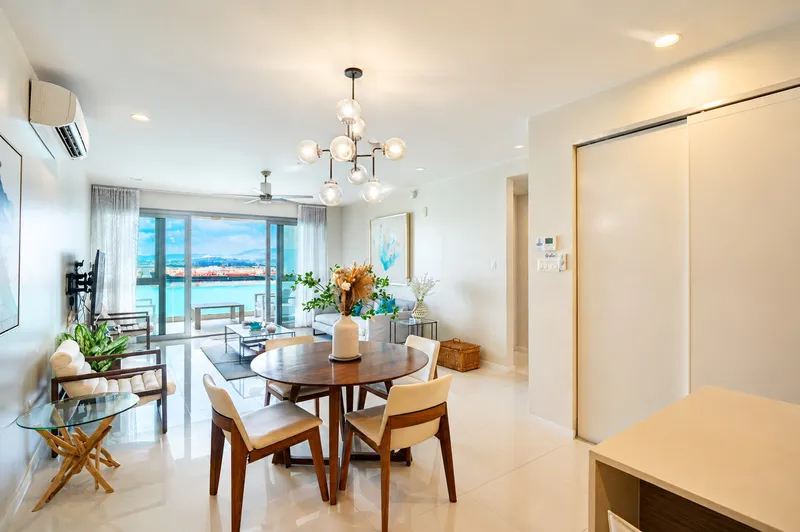 Open-plan living and dining room with sea views in a Soleil Residences apartment