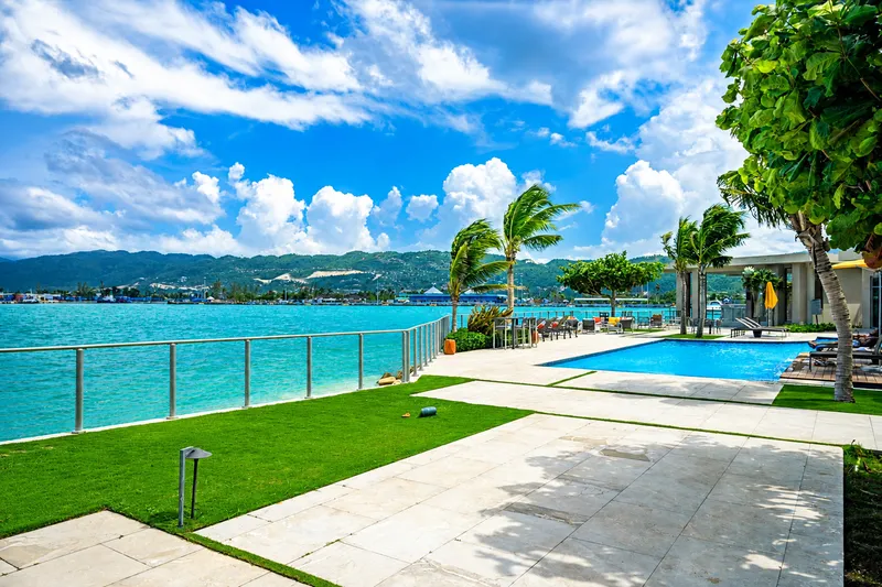 Oceanfront pool deck and lawn at Soleil Residences overlooking Montego Bay